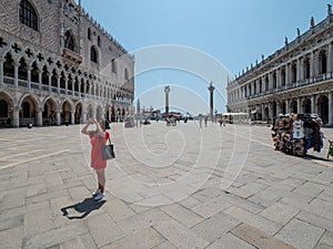 Venice, San Marco, Italy - July 2020. Tourist are slowly back in deserted Venice  Saint Marcus square after covid-19 outbreak city